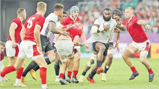  ?? Picture: JOVESA NAISUA ?? Flying Fijians centre Semi Radradra on attack against Wales during their final pool match at the Oita Stadium in Oita, Japan.