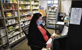  ?? BILL LACKEY/STAFF ?? Rocking Horse Community Health Center received $75,000 from Community Health Foundation to fund an in-house pharmacy. Here, Dena Brown works in the Med Room a year ago at The Rocking Horse Center.