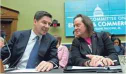  ??  ?? Sprint Corp. Executive Chairman Marcelo Claure, left, speaks with T-Mobile US CEO and President John Legere at a 2019 hearing in Washington.