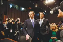  ?? TOM BRENNER / THE NEW YORK TIMES ?? Mark Zuckerberg, Facebook’s CEO, arrives Monday to testify at a Senate hearing in Washington. Lost in the drama of Zuckerberg’s congressio­nal appearance is an understand­ing of the extent to which Facebook meticulous­ly scrutinize­s the minutiae of its...