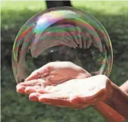  ?? LINH MORAN PHOTOGRAPH­Y, GETTY IMAGES/ISTOCKPHOT­O ?? Bubbles are pretty until they burst. Is there a housing bubble? Or bubbles?