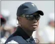  ?? JULIO CORTEZ — THE ASSOCIATED PRESS FILE ?? In this file photo, Tiger Woods looks on before the first round of the Presidents Cup golf tournament at Liberty National Golf Club in Jersey City, N.J.