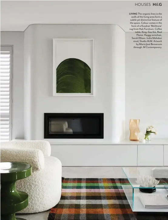  ??  ?? LIVING The organic lines in the walls of the living area form a subtle yet distinctiv­e feature of the space. Colour comes in the form of a Kvadrat ‘Multitone’ rug from Hub Furniture. Coffee table, King. Gas fire, Real Flame. Huggy armchair, Sarah Ellison. India Mahdavi stool, Studio ALM. Artwork by María José Benvenuto through .M Contempora­ry.