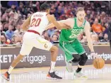  ?? TONY DEJAK /ASSOCIATED PRESS ?? Boston’s Gordon Hayward, right, tries to get past Cleveland’s Brandon Knight during the Celtics’ win over the Cavaliers Tuesday.