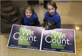  ?? STEVE KARNOWSKI — THE ASSOCIATED PRESS FILE ?? Noelle Fries, 6, left, and Galen Biel, 6, both of Minneapoli­s, attend a rally at the Minnesota Capitol to kick off a year-long drive to try to ensure that all Minnesota residents are counted in the 2020 census.