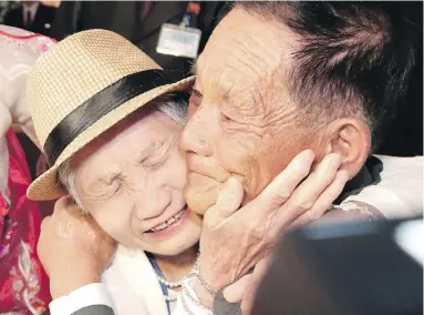  ?? LEE JI-EUN/YONHAP VIA AP ?? South Korean Lee Keum-seom, 92, left, weeps with her North Korean son Ri Sang Chol, 71, during the separated-family reunion meeting at the Diamond Mountain resort in North Korea on Monday.