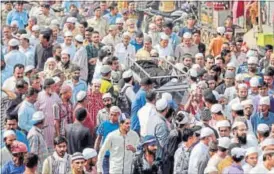  ??  ?? Crowds throng the funeral procession of Mujeeb Sheikh in Ahmedabad on Wednesday. He was one of the eight Students’ Islamic Movement of India (SIMI) operatives killed in an encounter on Monday. REUTERS
