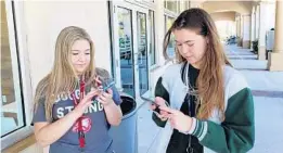  ?? GEOFFREY A. FOWLER/THE WASHINGTON POST ?? Jaclyn Corin, left, and Sarah Chadwick are among the Stoneman Douglas High students using Twitter to focus attention on gun control after 17 were killed at their school.