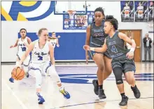  ?? Courtney Couey, Ringgold Tiger Shots ?? Ringgold’s Maggie Reed looks to get around the Beach defense during a Class 3A Elite Eight battle at David Moss Gymnasium last Wednesday. The Lady Tigers’ season came to an end with a 47-31 loss to the Bulldogs from Savannah.