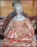  ??  ?? Wax doll circa 1848-1868, left, and an Antique Parian bisque doll made in Germany circa 1860-1870.