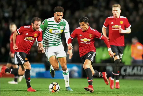  ?? Reuters ?? In sync: Manchester United’s Juan Mata (left) believes the arrival of Alexis Sanchez (second from right) will raise the level of competitiv­eness in the team. —