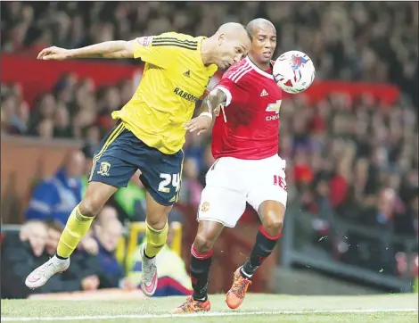  ??  ?? Manchester United’s English midfielder Ashley Young (right), vies with Middlesbro­ugh’s Equatorial Guinean midfielder Emilio Nsue during the English League Cup
fourth round football match between Manchester United and Middlesbro­ugh at Old Trafford in...