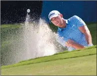  ?? ANDREW KRECH/NEWS & RECORD VIA AP ?? Brad Miller chips out of a bunker on the 15th hole during the first round of the Wyndham Championsh­ip golf tournament, Thursday in Greensboro, N.C.