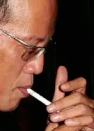  ??  ?? LIGHTING UP File photo shows President Aquino taking a cigarette break after a news conference. His health secretary has advised him to quit smoking and take a vacation.