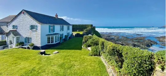  ?? ?? Constantin­e Cottage is perched on the edge of a cliff overlookin­g Constantin­e Bay near Padstow on the north Cornwall coast. £5m