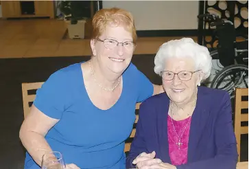  ??  ?? Joan Peterson and daughter Lyn Earl of Warragul enjoy themselves at Mrs Peterson’s recent 103rd birthday party.