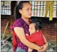  ?? PIC/PTI ?? A woman with her child at a relief camp for people displaced due to ethnic violence in Manipur