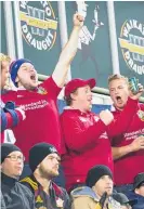  ?? Picture / Alan Gibson ?? Lions fans celebrate their big win as glum Chiefs supporters look on last night in Hamilton.