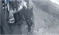  ??  ?? Caught in act: CCTV footage of armedmenro­bbing The Craic bar in Riccarton on Monday morning.