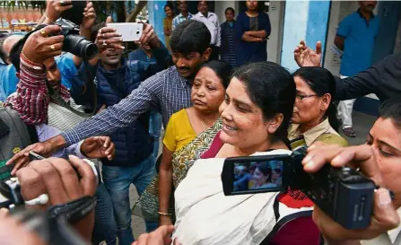  ??  ?? Under arrest: Police officials escorting Chakrabort­y from a police station in Jalpaiguri after her arrest as part of an alleged child traffickin­g scandal. — AFP