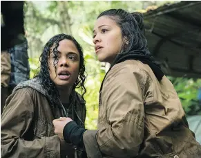  ??  ?? Tess Thompson, left, and Gina Rodriguez are shown in this scene from the new movie Annihilati­on.