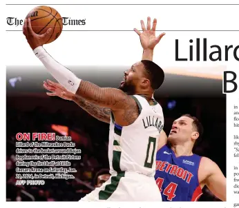  ?? AFP PHOTO ?? ON FIRE!
Damian Lillard of the Milwaukee Bucks drives to the basket around Bojan Bogdanovic of the Detroit Pistons during the first half at Little Caesars Arena on Saturday, Jan. 20, 2024, in Detroit, Michigan.