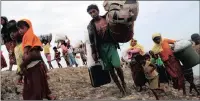  ?? PICTURE: REUTERS ?? Rohingya refugees walk in Teknaf after crossing the Naf River with an improvised raft to reach Bangladesh this week.