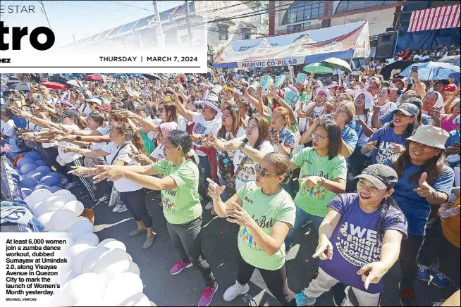  ?? MICHAEL VARCAS ?? At least 6,000 women join a zumba dance workout, dubbed Sumayaw at Umindak 2.0, along Visayas Avenue in Quezon City to mark the launch of Women’s Month yesterday.