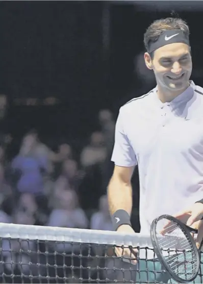  ??  ?? 0 Andy Murray and Roger Federer share a joke at the end of last night’s exhibition match at the ‘Andy Murray Live’ event at Glasgow’s SSE Hydro. Federer beat Murray 3-6, 6-3 (5-10).