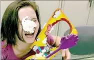  ?? PHOTO SUBMITTED ?? Serenity Benson, 11, reacts after getting a pie in the face while playing a game during teen night.