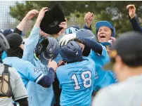  ?? ?? Reavis’ Tino Villagomez, center, celebrates with teammates after hitting a home run against Marian Catholic.