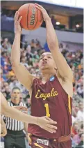  ?? TONY GUTIERREZ/THE ASSOCIATED PRESS ?? Loyola-Chicago guard Lucas Williamson drives on Tennessee’s defense on Saturday in the NCAA Tournament in Dallas. Seeded 11th, Loyola-Chicago beat the No. 3 seed 63-62 to make a rare trip to the Sweet 16.