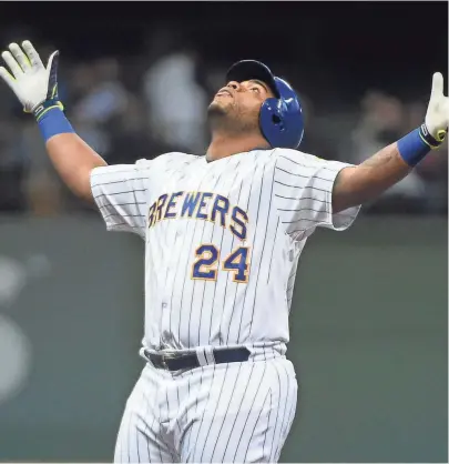  ?? BENNY SIEU / USA TODAY SPORTS ?? Jesús Aguilar reacts after hitting a clutch two-run double in the seventh inning against the San Francisco Giants.