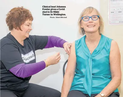  ?? Photo / Mark Mitchell ?? Clinical lead Johanna Fowler gives a Covid shot to Dr Nikki Turner in Wellington.