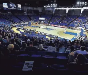  ?? GEORGE WALKER IV/THE TENNESSEAN ?? Fans watch the TSSAA girls basketball state championsh­ips quarterfinal games at Murphy Center on March 12 in Murfreesbo­ro.