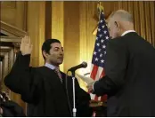  ?? RICH PEDRONCELL­I — THE ASSOCIATED PRESS FILE ?? Mariano-Florentino Cuellar, left, is sworn in as an associate justice to the California Supreme Court by Gov. Jerry Brown during an inaugurati­on ceremony in Sacramento.