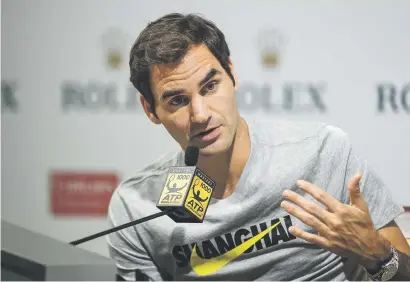  ?? Picture: AFP ?? UNREAL. Roger Federer is still pinching himself after winning two Grand Slam titles this year.