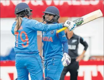  ?? REUTERS ?? India captain Mithali Raj (right) is congratula­ted by Veda Krishnamur­thy on completing her century against New Zealand.