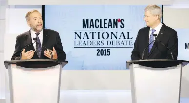  ?? MARKBLINCH /THE CANADIAN PRESS / POOL ?? NDP Leader Tom Mulcair makes a point while Conservati­ve Leader Stephen Harper looks on during the Maclean’s National Leaders debate in Toronto on Thursday. Mulcair was trying to project a prime ministeria­l air, Stephen Maher says.