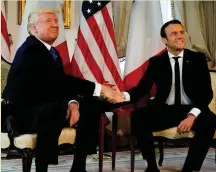  ??  ?? US President Donald Trump shakes hands with French President Emmanuel Macron before the Nato summit in Brussels yesterday. Photo: Reuters/Peter Dejong