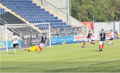  ?? PICTURE: IAIN ROBB ?? On target Luke McCowan puts Ayr ahead from close range shortly after the break.