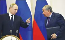  ?? Igor Sechin, right, the chief executive of Russia’s top oil producer Rosneft, has a reputation as one of Vladimir Putin’s closest allies. ??