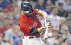  ?? Michael Dwyer / Associated Press ?? Boston’s Xander Bogaerts hits a double during the seventh inning of a game against Tampa Bay on Friday.