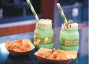  ?? ?? The Unnecessar­ily Spicy, Yet Extremely Tasty Scotch Bonnet Pepper-Curry Wings with cool cucumber yogurt, and the Brew-Wing Lab Pickled Milkshakes, featured at the 2023 Epcot Internatio­nal Food & Wine Festival, which runs through Nov. 18.