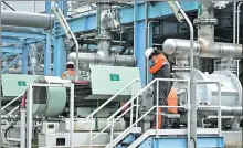  ?? BAY ISMOYO / AGENCE FRANCE-PRESSE ?? Plant technician­s inspect machinery at the Wayang Windu geothermal power station on West Java in Indonesia last month. Indonesia is home to about 130 volcanoes.