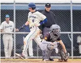  ?? ?? La Cueva’s Jackson Wix, left, crosses home plate as he and the Bears pound on Cibola High School Wednesday afternoon at La Cueva High School.