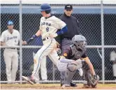  ?? ?? La Cueva’s Jackson Wix, left, crosses home plate as he and the Bears pound on Cibola High School Wednesday afternoon at La Cueva High School.