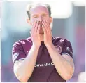  ??  ?? Hearts’ Aidan White shows his frustratio­n as he goes off injured