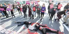  ?? (Marc Israel Sellem/The Jerusalem Post) ?? PROTESTERS BLOCK the entrance to Jerusalem at the Strings Bridge yesterday as they call to end domestic violence, following the murders of two young women in the past week.