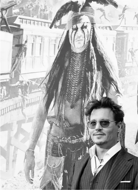  ?? JOHN Shearer / The ASSOCIATED PRESS ?? “I’m used to living like a fugitive now,” Johnny Depp says of the media attention he gets.